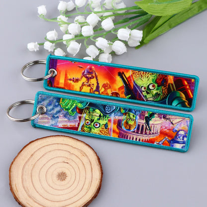 Embroidered Keychain - Cartoon Characters Scooby-Doo gang, retro robots, Humorous stick figures, and action-packed dinosaurs and warriors.