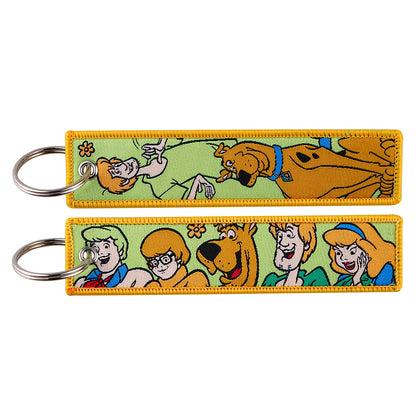 Embroidered Keychain - Cartoon Characters Scooby-Doo gang, retro robots, Humorous stick figures, and action-packed dinosaurs and warriors.